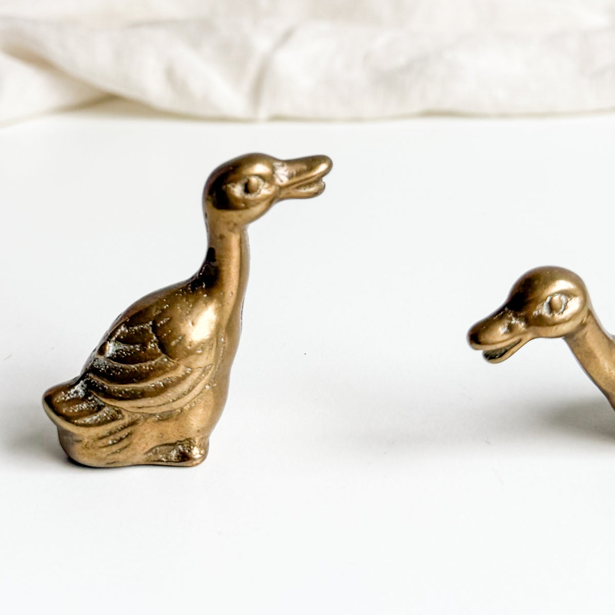 Pair of Small Brass Geese